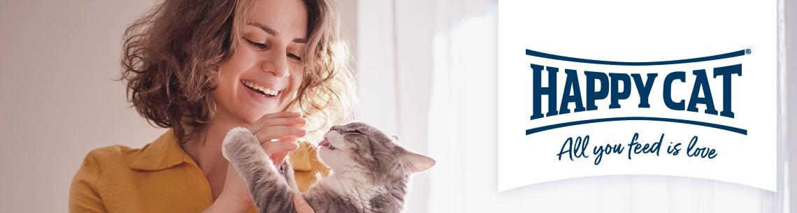 Topbanner Happy Cat Person hält eine Katze, daneben Happy Cat Logo.